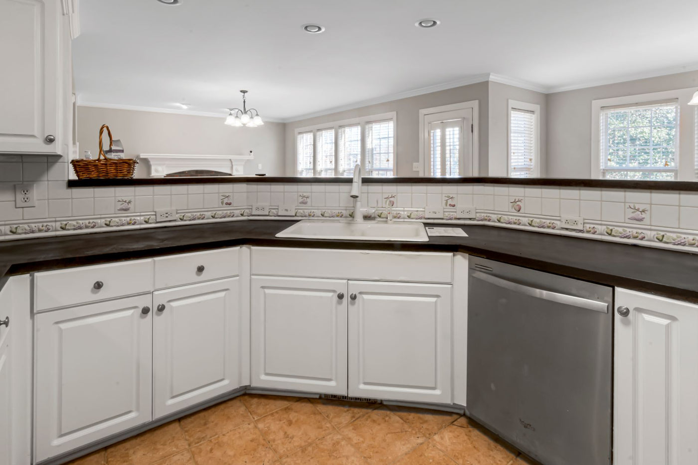Spacious contemporary kitchen featuring minimalist design and elegant marble countertops.