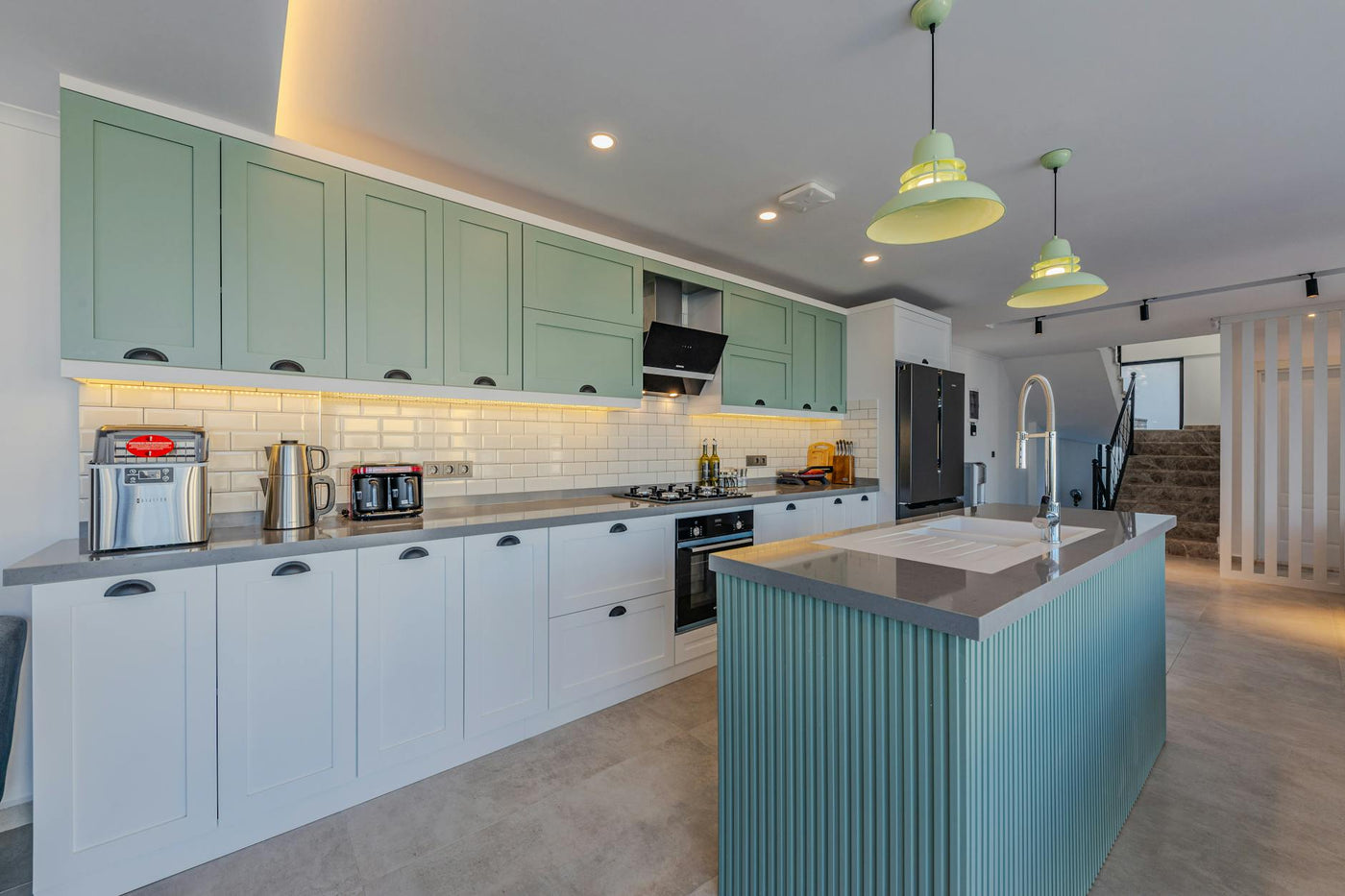 Stylish kitchen featuring contemporary design, an island, and modern appliances.