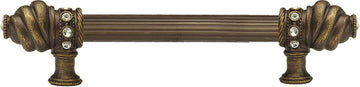 Caché 6'' cc with 5/8'' reeded center long pull with 16 rivoli Swarovski Clear Crystals in Antique Brass. 5670R-3C