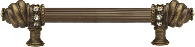 Caché 6'' cc with 5/8'' reeded center long pull with 16 rivoli Swarovski Clear Crystals in Antique Brass. 5670R-3C