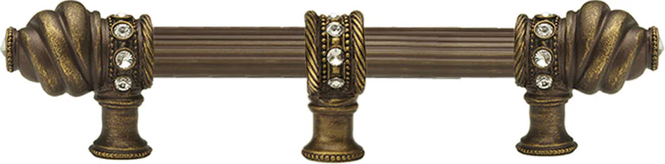 Caché 6'' cc with 5/8'' reeded center long pull & center brace with 16 rivoli Swarovski Clear Crystals in Antique Brass. 5675R-3C