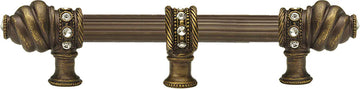 Caché 6'' cc with 5/8'' reeded center long pull & center brace with 16 rivoli Swarovski Clear Crystals in Antique Brass. 5675R-3C