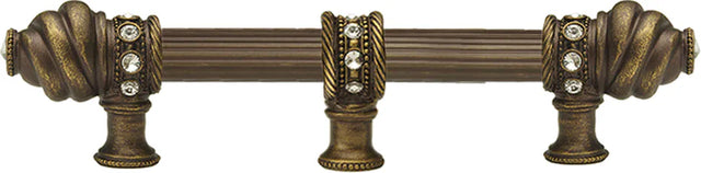 Caché 6'' cc with 5/8'' reeded center long pull & center brace with 16 rivoli Swarovski Clear Crystals in Antique Brass. 5675R-3C