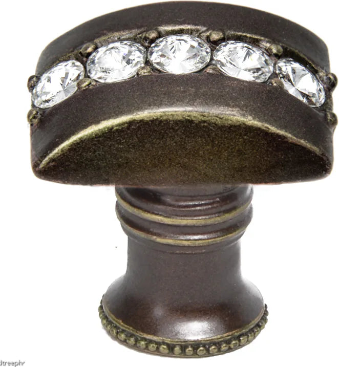 Caché rectangle knob with flared foot with center of 5 rivoli Swarovski Clear Crystals in Antique Brass. 872B-3C
